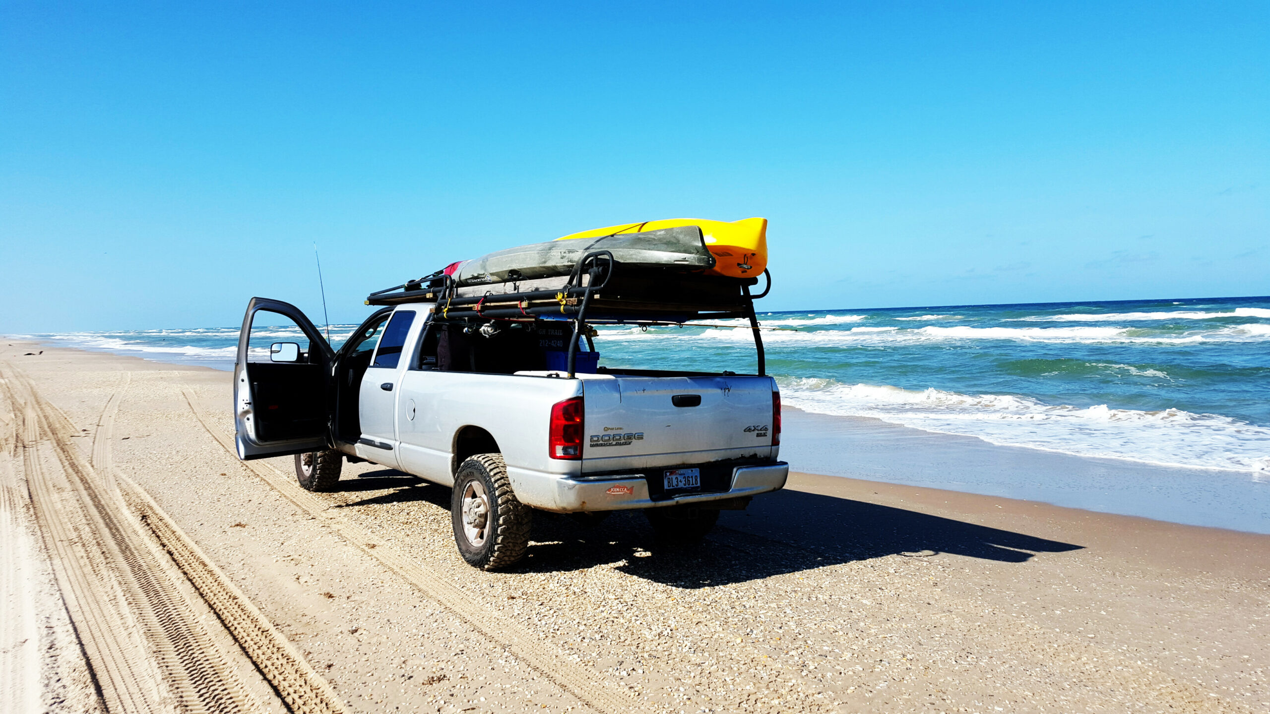 Kayaks loaded on top of pickup 