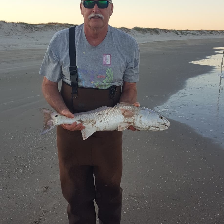 wintertime surf fishing - Ken Kunh with a nice redfish