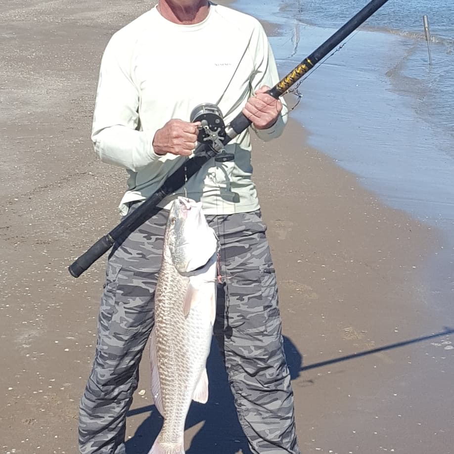 wintertime surf fishing - Jerry Gerwick with an oversized bull red