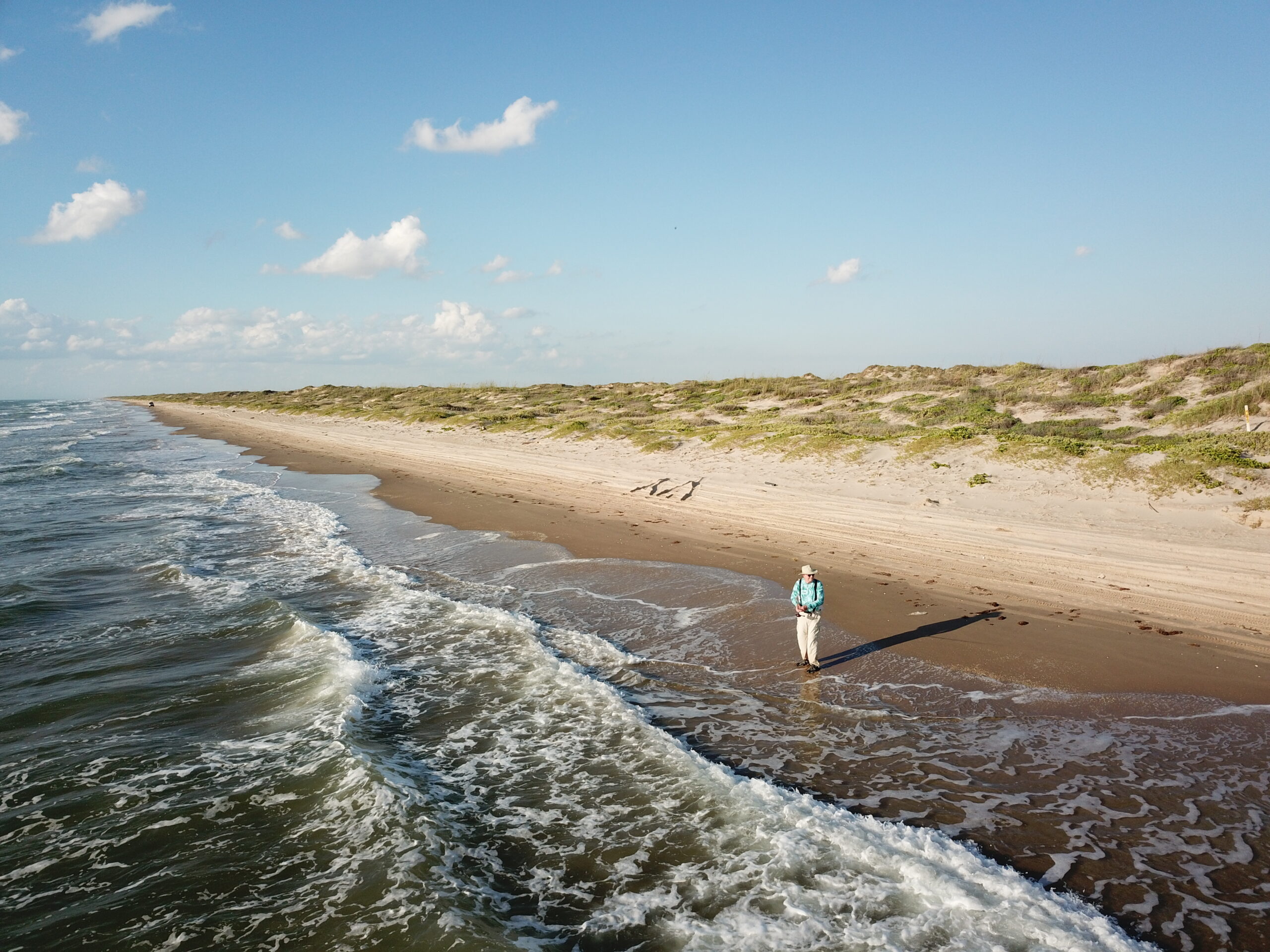 JT McMahon fishing the surf of Padre Island Texas. Surf Fishing Quick Start guide review