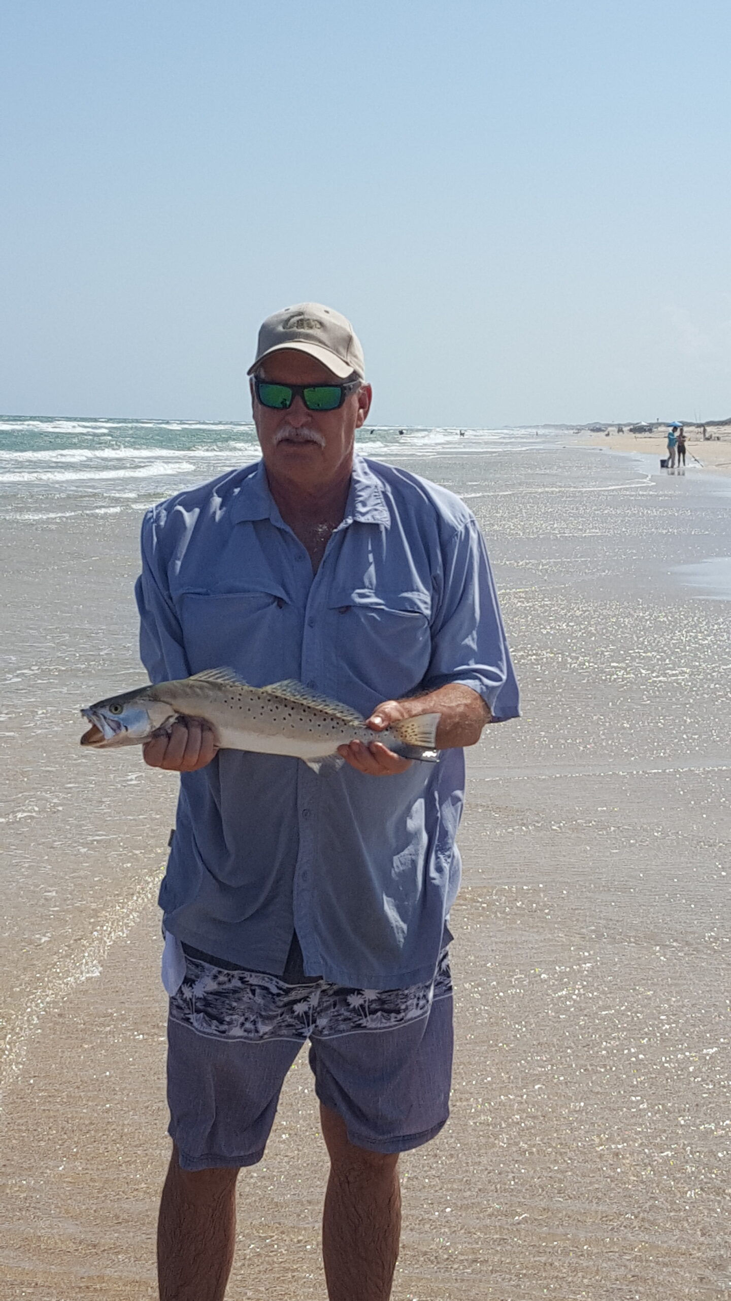 wintertime surf fishing - Ken Kuhn with a surf run speckled trout