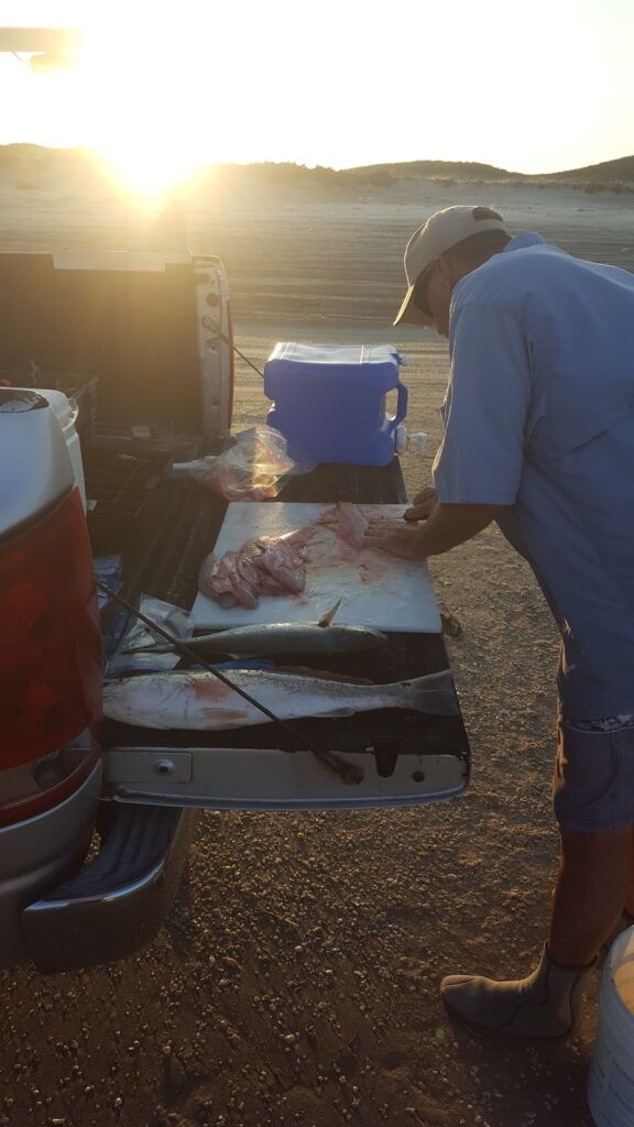 cleaning the days catch the old way on the tailgate of the pickup