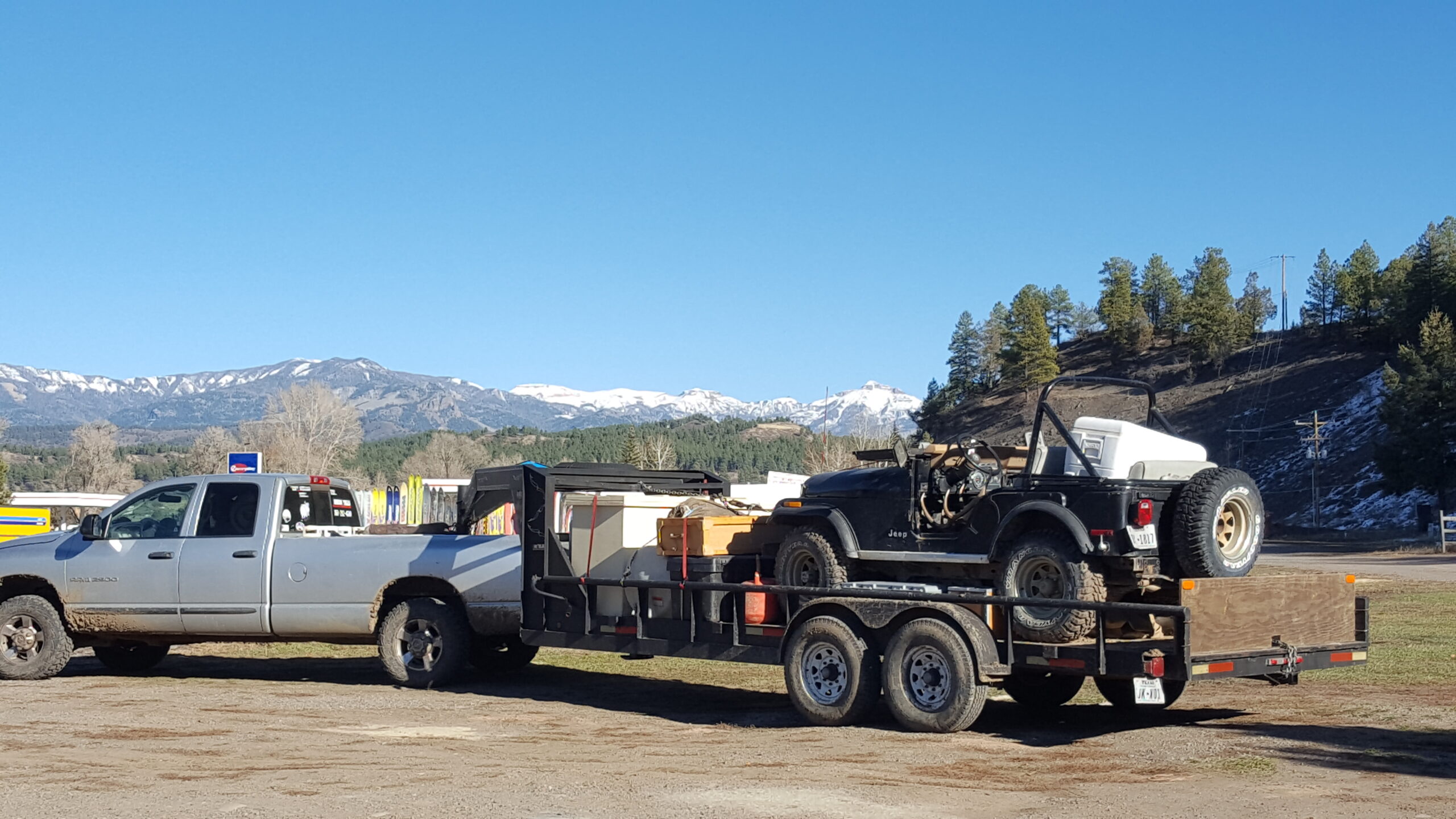 Loaded truck and trailer - outfitting a colorado elk hunt