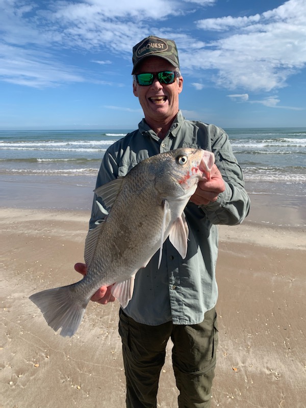 Author with a nice black drum caught in the surf