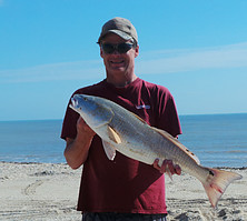 Rex McMahon with surf redfish