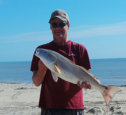 Rex McMahon with a slot red on Matagorda Beach Texas