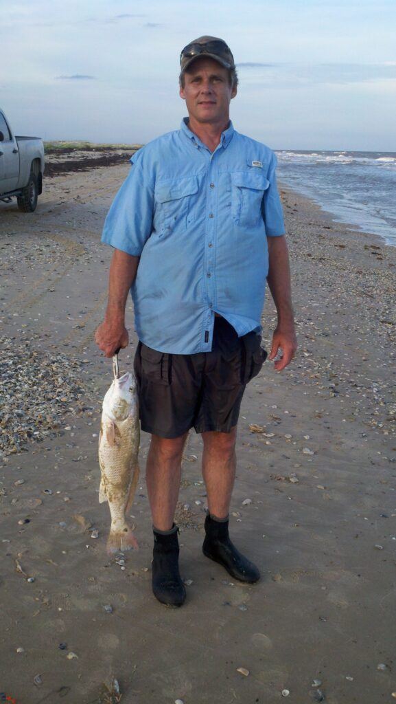 Rex McMahon with slot redfish matagorda beach texas. 