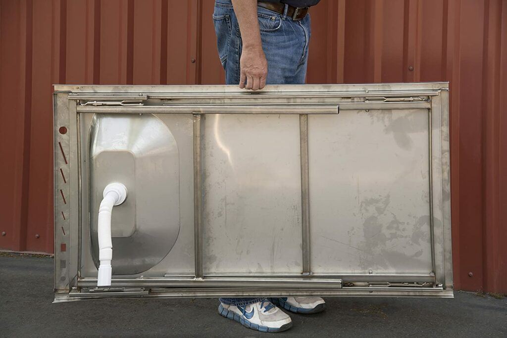 Organized Fishing's Stainless steel fish cleaning table folded up for easy storage and transport.