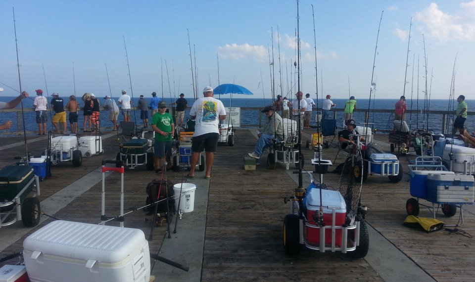 fishing carts on the pier loaded down with gear