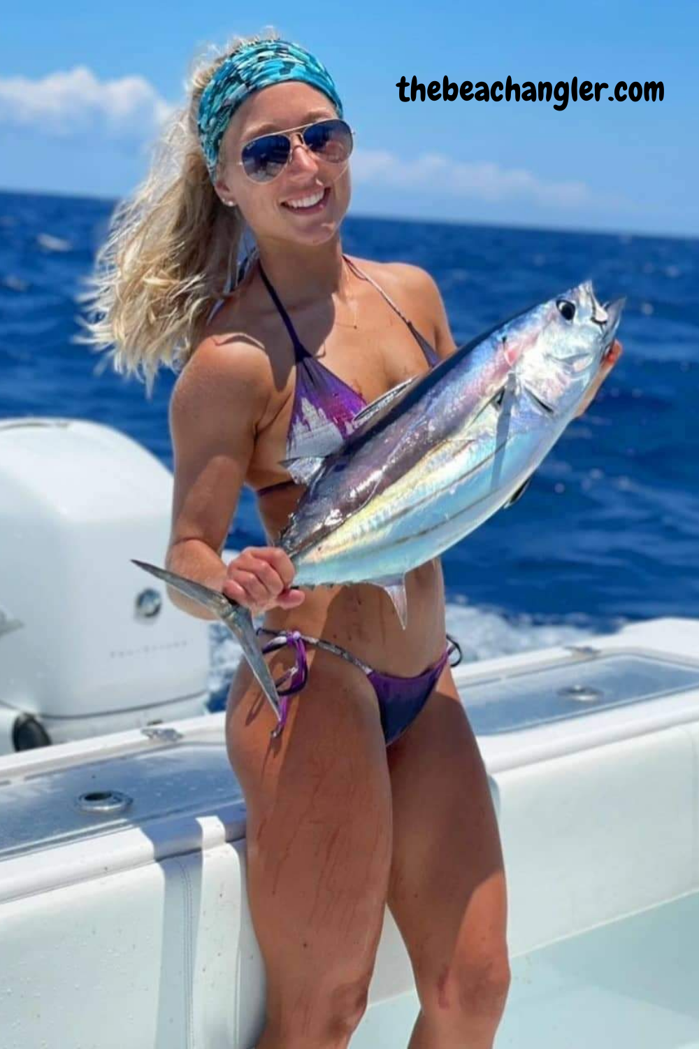 Lady with a live bonita. They make great live bait for Marlin. She caught it using live Pilchards caught with a cast net