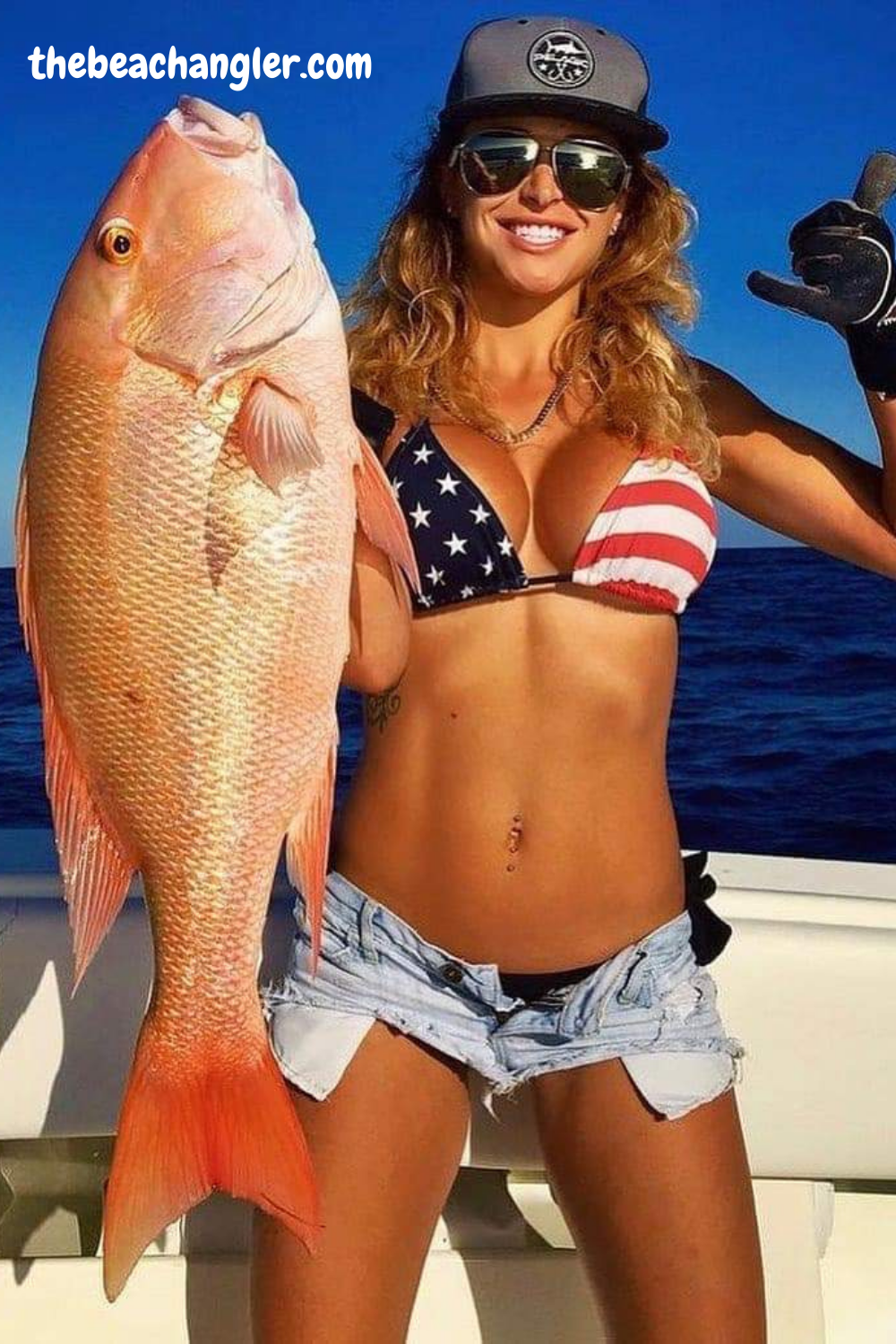 Lady with a giant of a Red Snapper hauled up with a Penn reel.