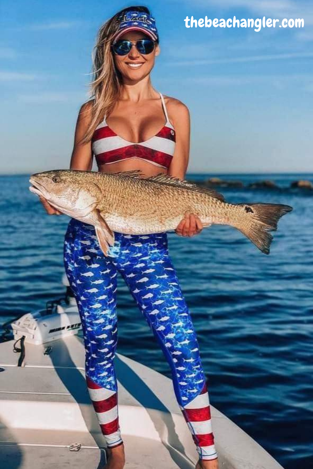 Lady with a nice bull redfish caught off the beach