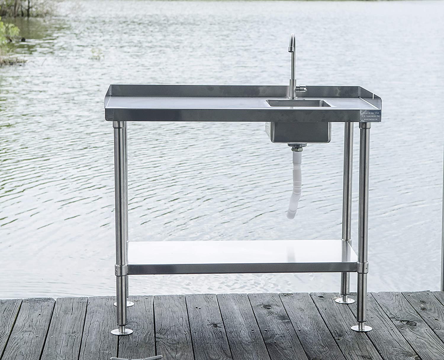 RITE-HITE stainless steel fish cleaning table mounted to dock