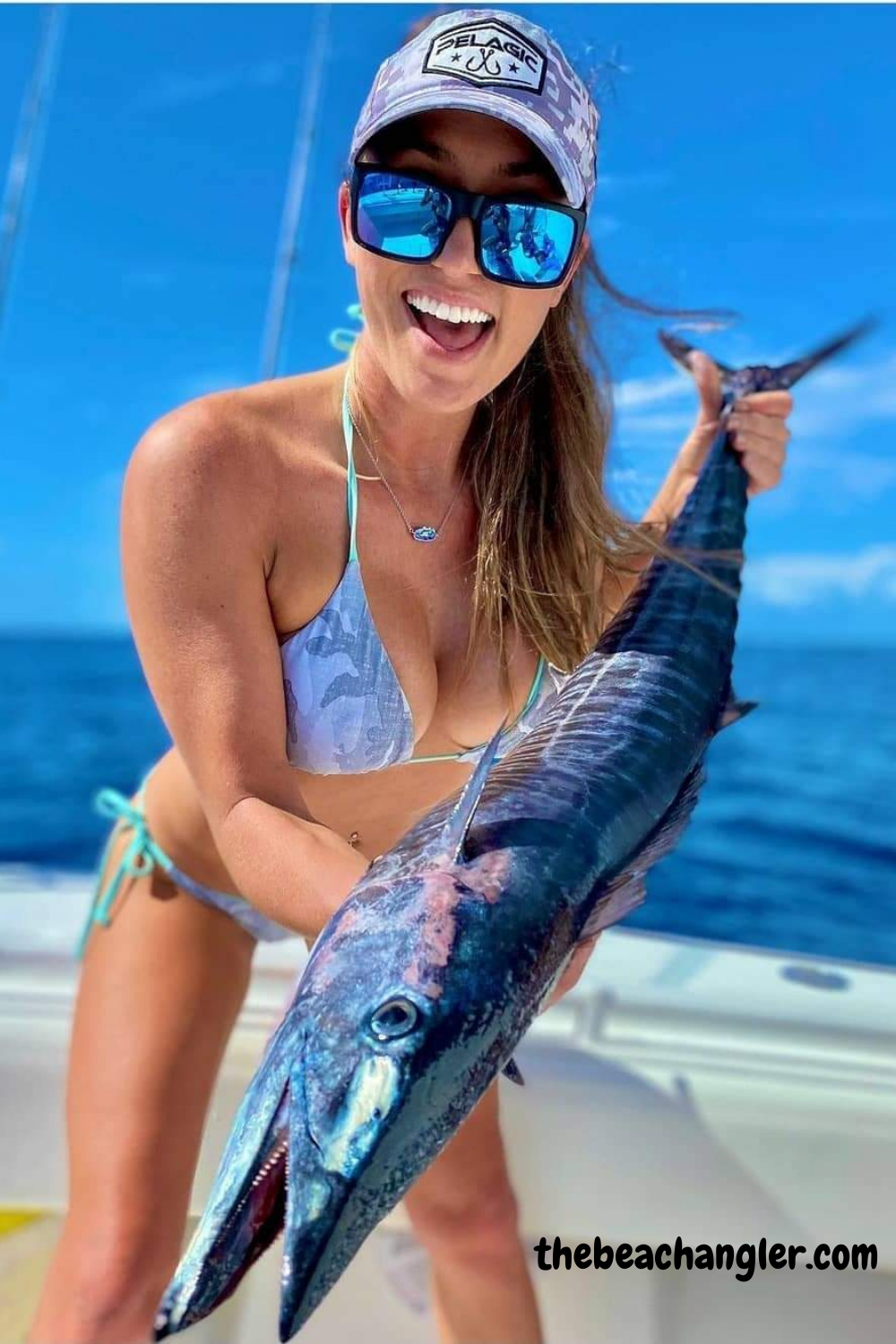 Lady with a large Wahoo caught using live pilchards for bait that were caugh using a cast net