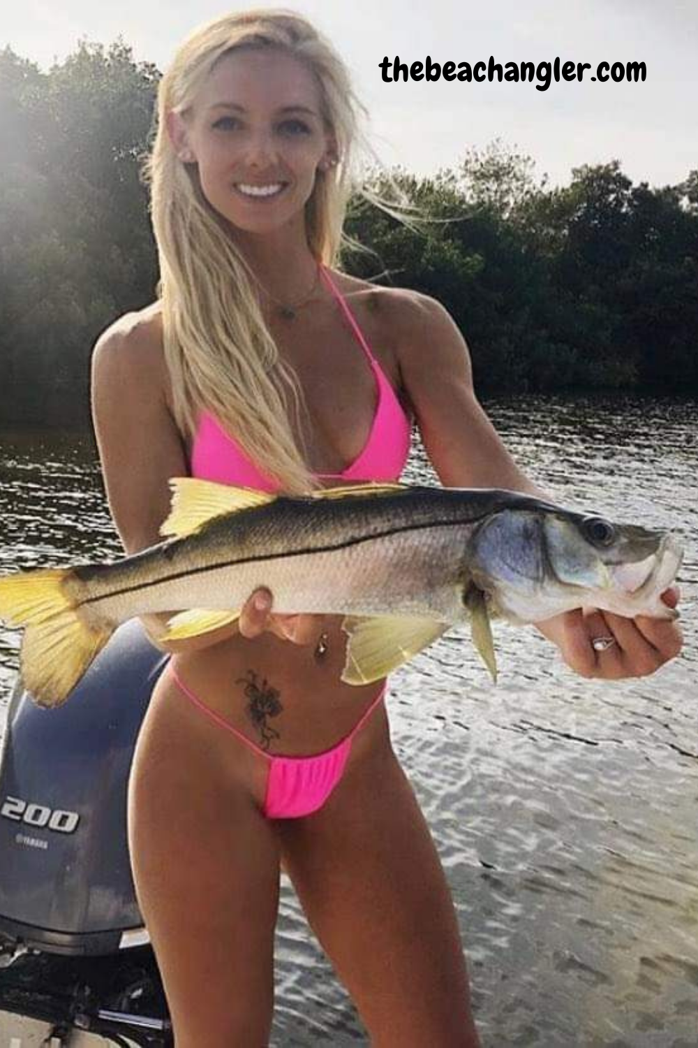 Young lady with a nice snook caught using a Tsunami Rod.