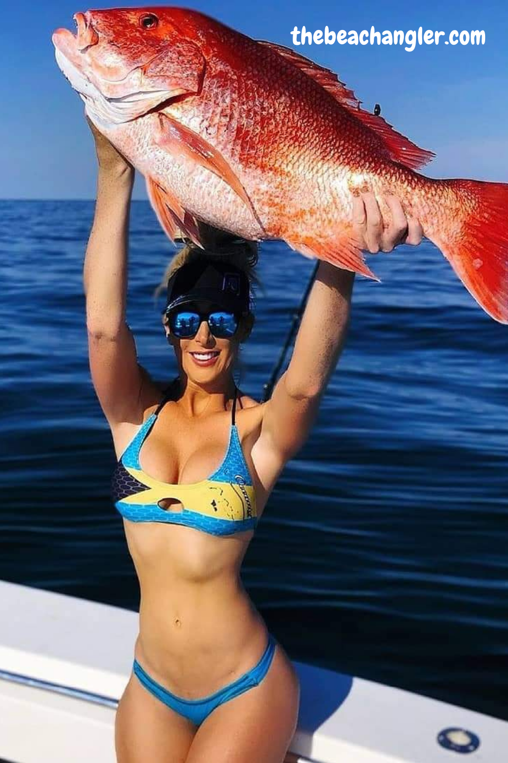 Lady with a huge red snapper. Surf fishing RC Bait Boats.