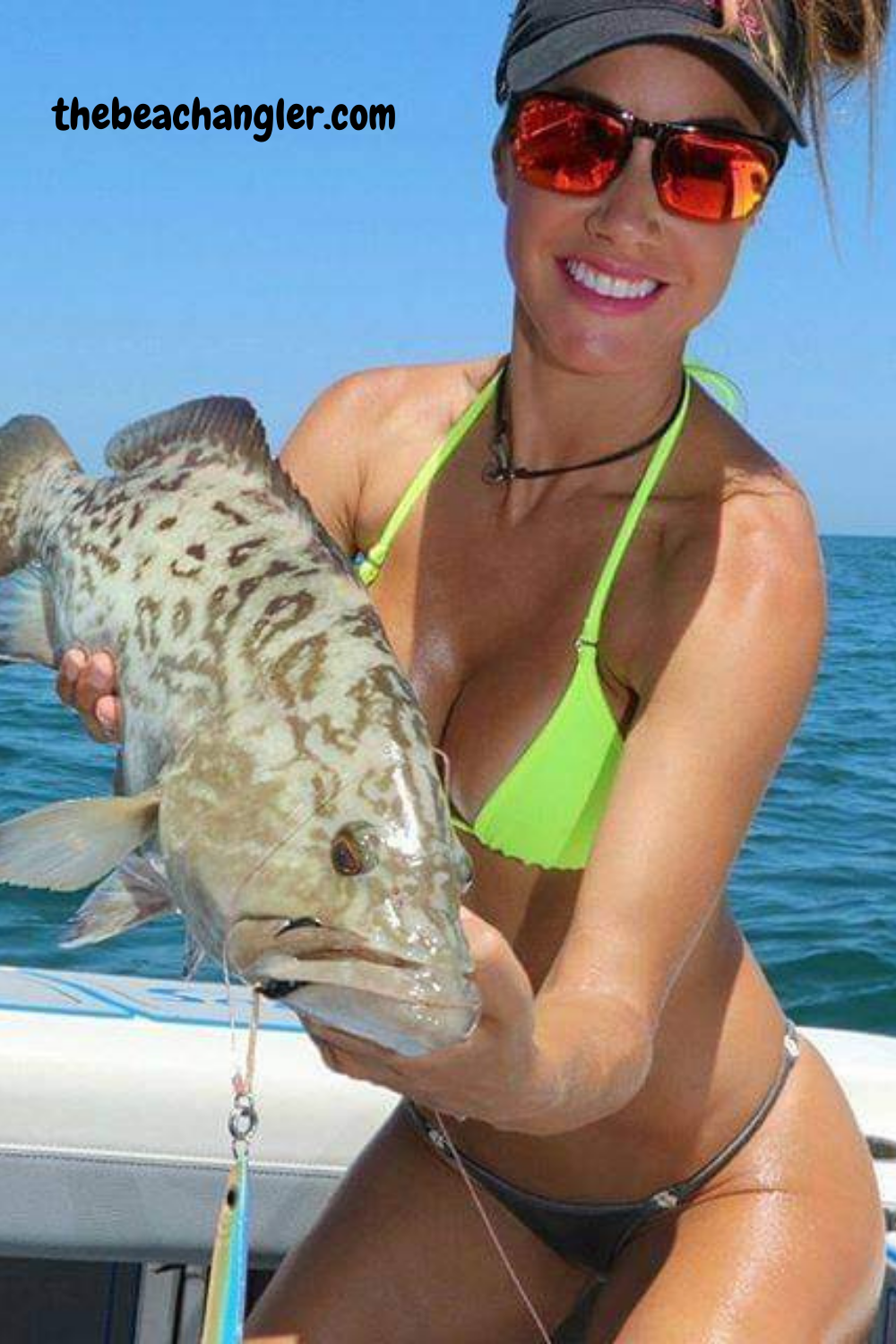Lady with a nice grouper she jigged off the bottom using a Daiwa Spinning Reel - Best Daiwa Spinning Reels Review