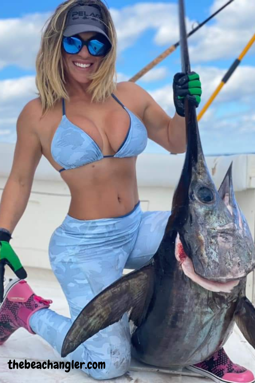 Lady with a nice swordfish caught using a Penn International reel
