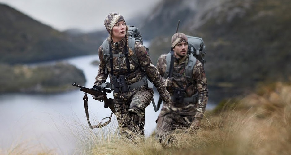  a couple of hunters wearing modern camo wool hunting clothes