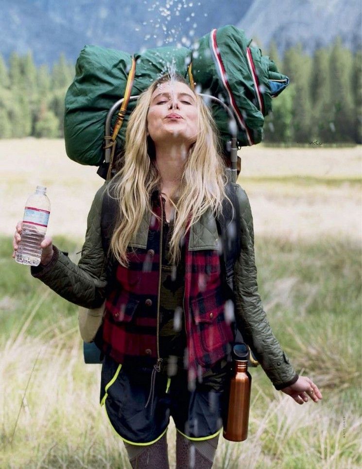 young lady hiking in her merino wool hiking vest
