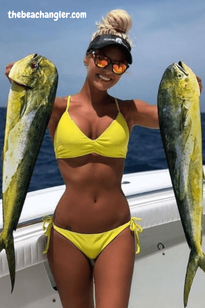 Nice young lady with a pair of Mahi Mahi - Cobra Marine Radios review