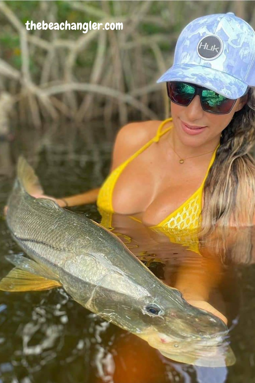 Young lady with a nice snook caught while wade fishing. Foreverlast wading boots and ray guards.