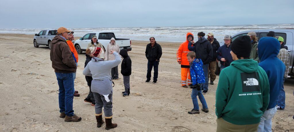 Billy Sandifer Big Shell Beach Cleanup volunteers getting their instructions at the beginning of their cleanup area