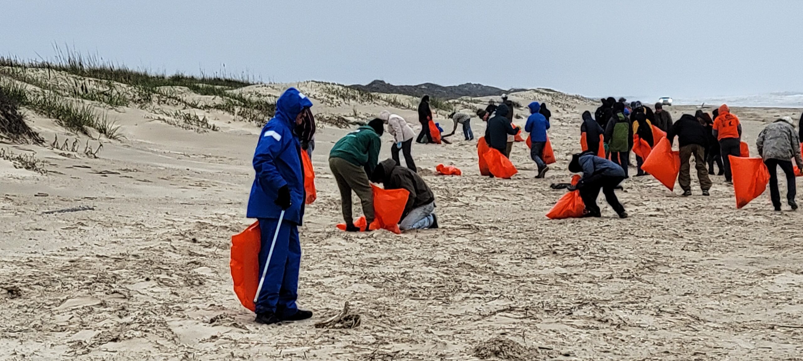 Billy Sandifer Big Shell Beach cleanup - volunteers picking up trash on the beach