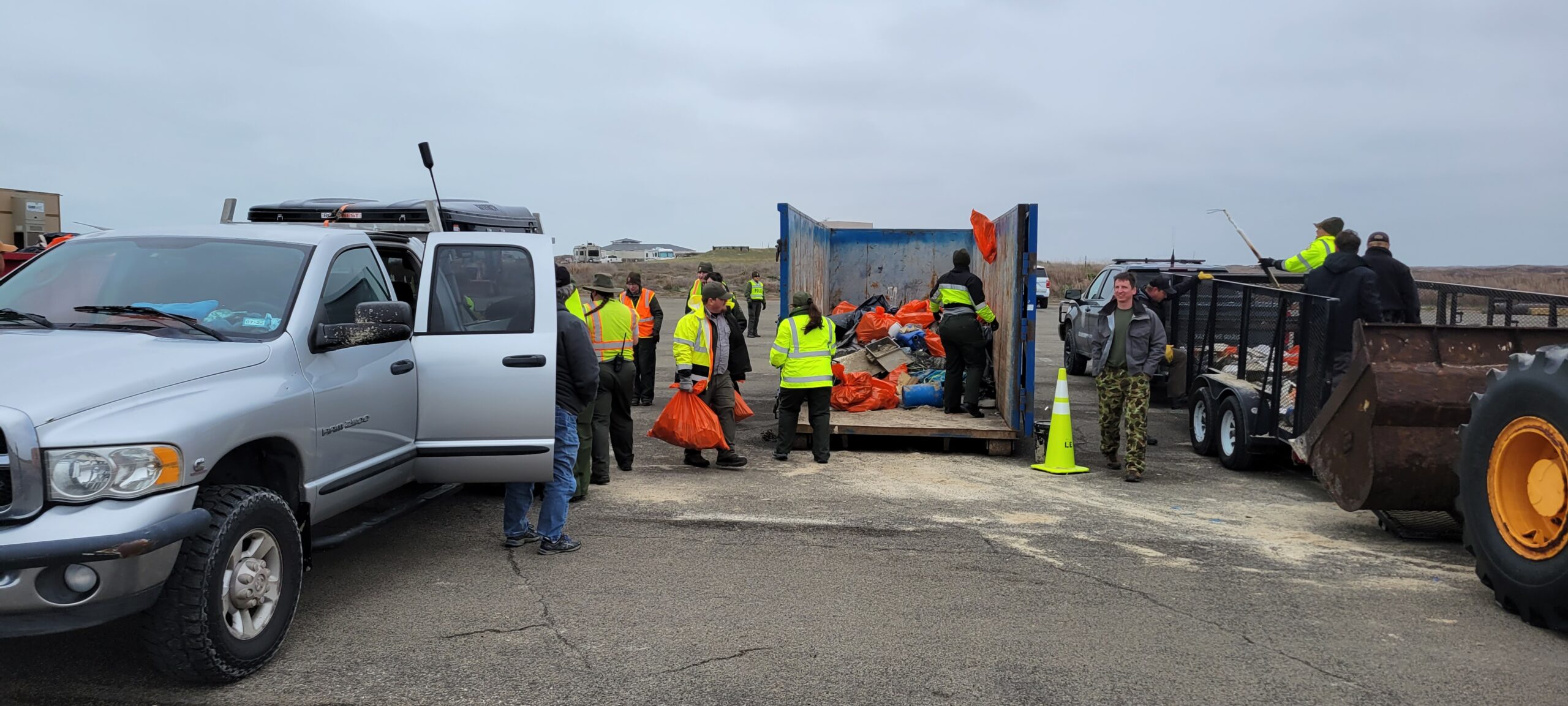 27th annual Captain Billy Sandifer Big Shell Beach Clean up - unloading the trash from volunteers' trucks and trailers into dumpsters for proper disposal
