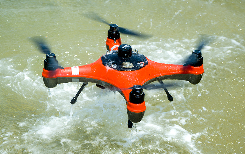 SwellPro Fisherman FD1 fishing drone landing in the water