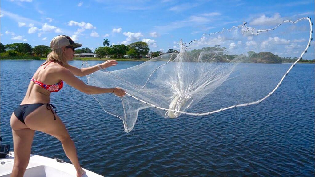 Best surf fishing bait - Vicky Stark throwing a castnet for bait