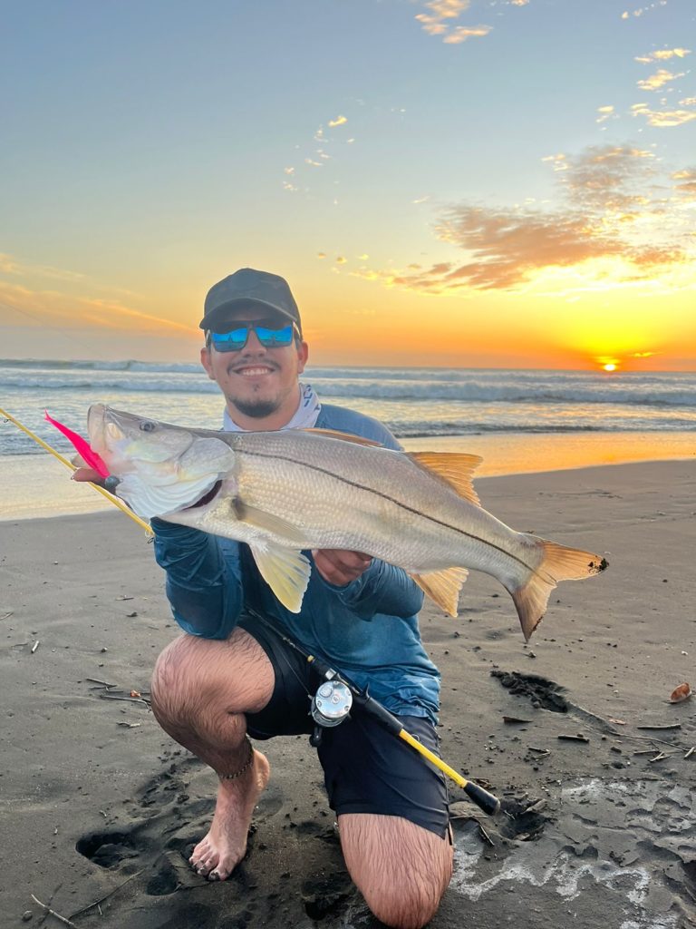 Angler with a nice Snook caught from the beach in Costa Rica