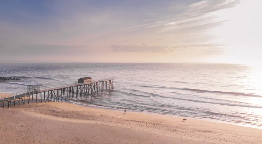 Belmar Beach New Jersey showing the fishing pier extending off the beach into the atlantic ocean