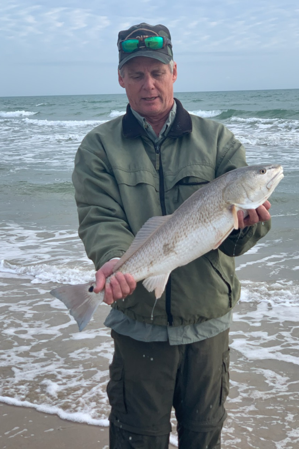 Author Rex McMahon with a nice slot redfish caught surf fisihing Padre Island National Seashore