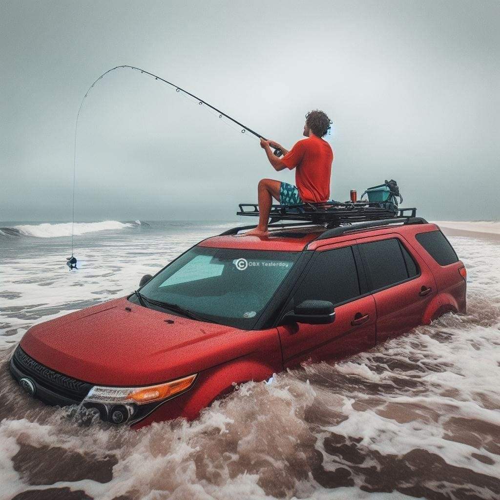 Man fishing from the roof of a car that has been trapped in the surf by hightide