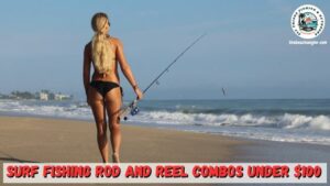 Lady angler in a black bikini carrying her surf fishing spinning rod and reel combo as she walks along the beach