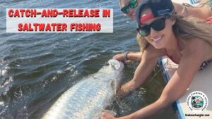 catch-and-release fishing for saltwater. Lady anglers releasing a large tarpon at the side of the boat