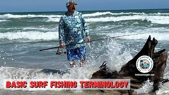 Surf Fishing Terminology featured image with surf angler wading the surf rod and reel in hand