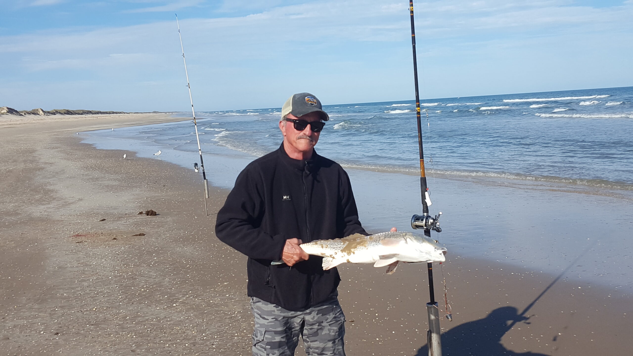 Gerry Gerwick with a nice slot redfish landed in the surf.