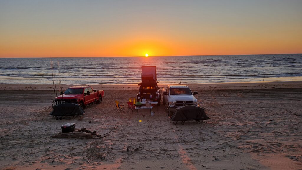 night fishing in the surf - image of sun rise over the Gulf of America from Padre Island National Seashore in Texas