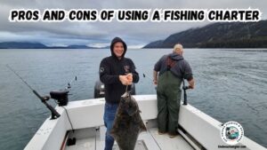 Pros and Cons of using a Fishing Charter for Saltwater featured image of Wade McMahon holding up a nice halibut while standing in the back of the boat with Discovery Charters in Kodiak Alaska.