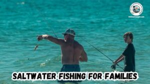 Saltwater fishing for families featured image with a dad and son wade fishing, and the dad is unhooking a small fish.