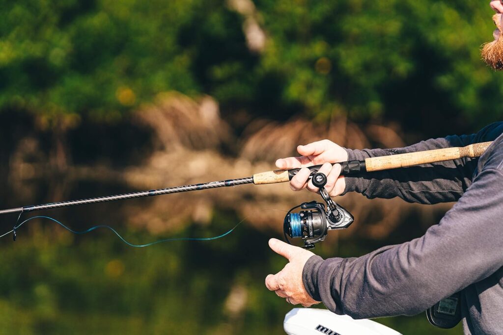 Angler casting the Penn Clash II Spinning Reel