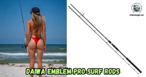 Daiwa Emblem Pro Surf Rods featured image showing a lady angler standing on the beach with her rod and reel and looking out over the surf.